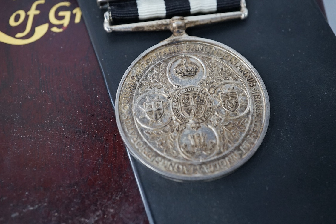 A Service Medal of the Order of St John’s with two clasps, together with a United Kingdom brilliant uncirculated coin collection 2008, plus a few other items. Condition - fair.